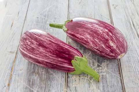 Two aubergines on table Stock Photos