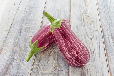 Two aubergines on table Stock Photos