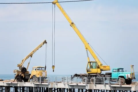 Two Auto Cranes On The Quay Stock Photos