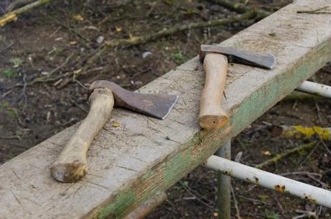 Two axes in forest Stock Photos
