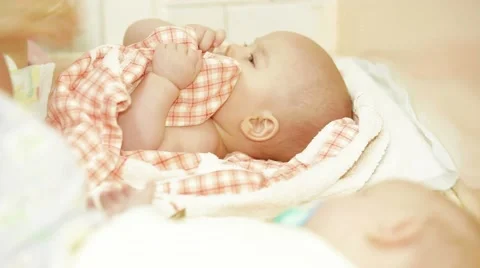Two Babies Being Dressed Stock-Footage 67582321