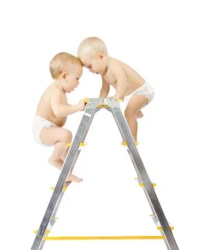 Two babies climbing on stepladder and fighting for first place on white Stock Photos