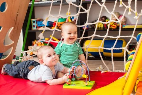 Two babies having fun Stock Photos