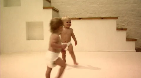 Two babies walking Stock Footage 43695336