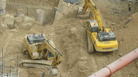 Two backhoes on the construction site in Dubai UAE Stock Footage 190604653