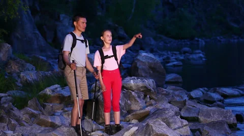 Two backpackers walk on rocky way Stock Footage 39589954