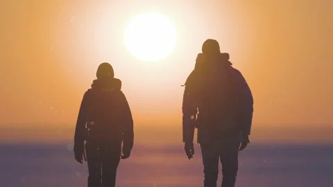 The two backpackers walking on the sunset background. slow motion Stock Footage 196285560