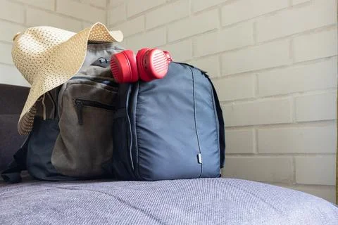 Two backpacks on the sofa Stock Photos