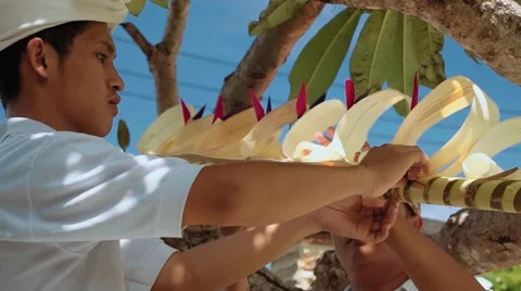 Two balinese men decorating a penjor on Galungan Day, close up Video stock 64286510
