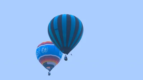 Two Ballons Fly Overhead at Putrajaya Hot Air Balloon Festival Stock-Footage 47874272