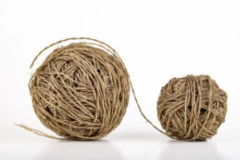 Two balls of coiled string for gardening. Cord for tying plants. Stock Photos