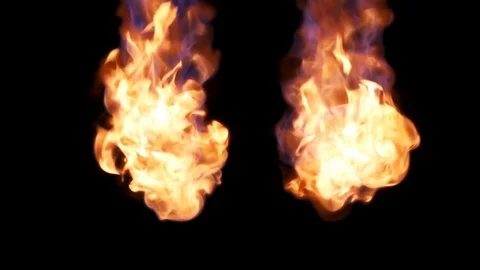 Two balls of flame start and end from above slow motion studio shot Stock Footage 77134580