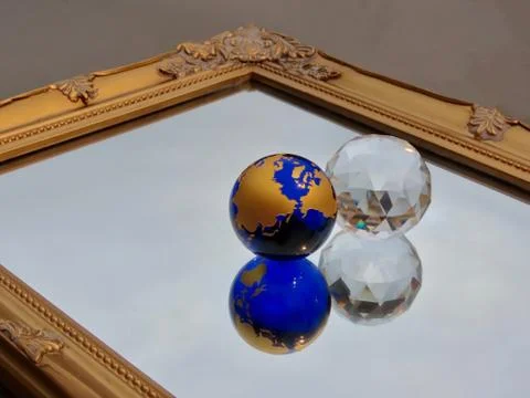 Two balls on mirror Stock Photos