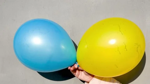 Two baloons blue and yellow , colors of Ukrainian flag, holiday concept Stock Footage 172418065