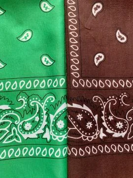 Two bandanas folded side by side showcase detailed paisley designs. The vibrant Stock Photos