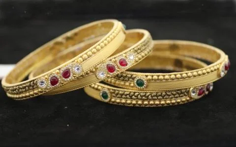Two Bangles Or Kadas Or Kangan places on a surface being focused Stock Photos