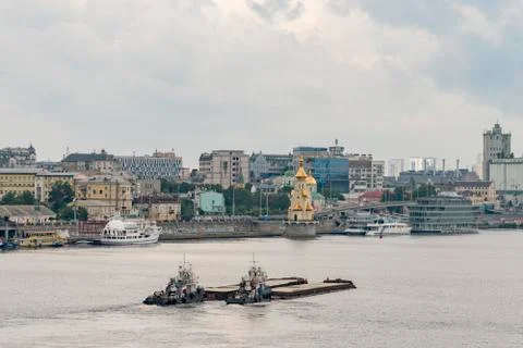 Two barges float on the river. Stock Photos