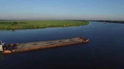 Two barges on the river floating towards each other. Aerial view. Stock Footage 64833294