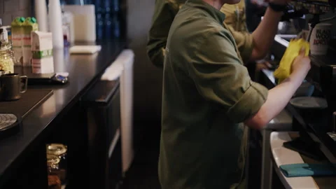 Two baristas work side by side in a modern coffee shop 스톡 동영상 313335188