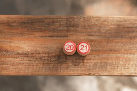 Two barrels with numbers 20 and 21 stand on a wooden base Stock Photos