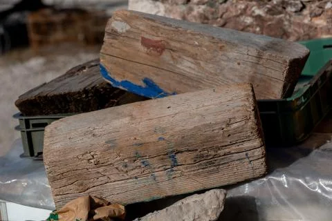 Two bars of old cracked brown firewood closeup Stock Photos