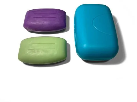 Two bars of soap lie on a white background. Stock Photos