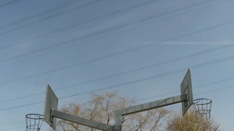 Two basketball hoops with clouds Stock Footage 74215447