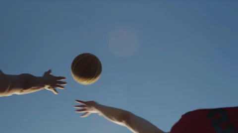 Two basketball players jumping at tip off on an outdoor court Stock-Footage 48845725