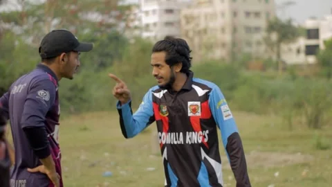Two Batsman Discussing Between in Local Cricket Game Stock Footage 293939746
