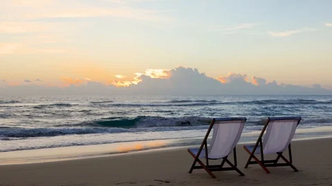 Two beach chairs on the beautiful sunset beach. Stock-Footage 91647405