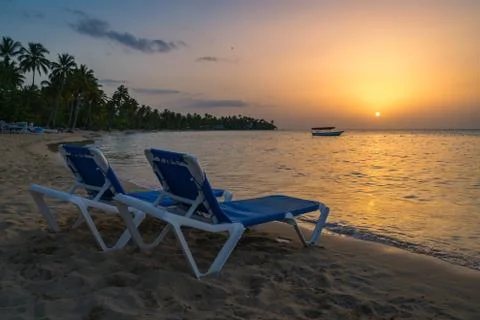Two beach chairs at sunset 库存照片