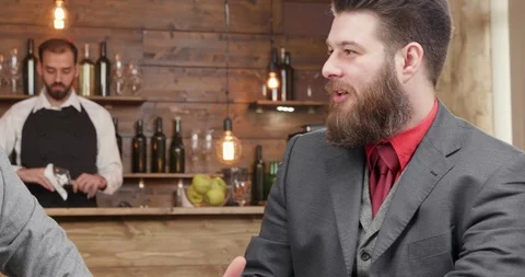 Two bearded friends on a break after office hours Stock Footage 104970056