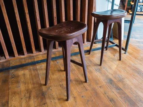 Two beautiful bar stools made of wood in a cafe Stock Photos