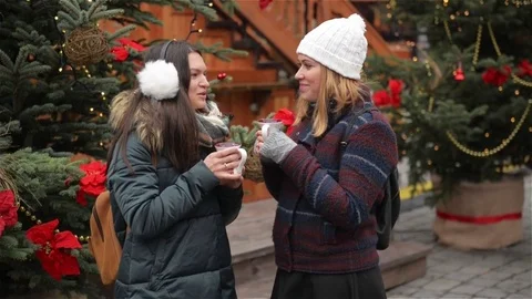 Two Beautiful Girlfriends Talking and Laughing on the Christmas Market. Friends Stock Footage 70201722