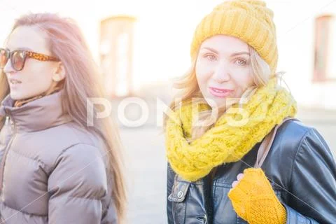 Two beautiful girls walking through the streets of Minsk Stock Photos