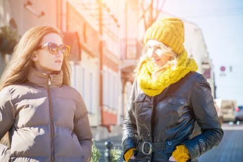Two beautiful girls walking through the streets of Minsk Stock Photos
