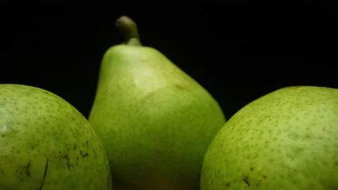 Two beautiful green pears on a tree branch. Pears taken on a close-up video Stock Footage 201105452