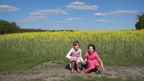 Two beautiful little sisters cheerfully jumping up Video stock 79052233