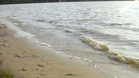 Two beautiful models  running along the shore of a beach in slow motion Video stock 82382399