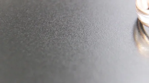 Two beautiful rings engraved with white and yellow gold on a black background Video stock 100593432