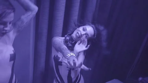 Two beautiful sexy disco dj women in bikinis performing in a club setting in Video stock 135250153