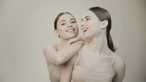 Two beautiful twin sisters in the studio.  Stock Footage 132880531