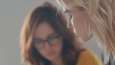 Two beautiful women work in a creative atmosphere 스톡 동영상 104102431