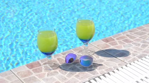 Two beautiful yellow-green-blue cocktails with straws, sunglasses by pool 库存影片 132644067