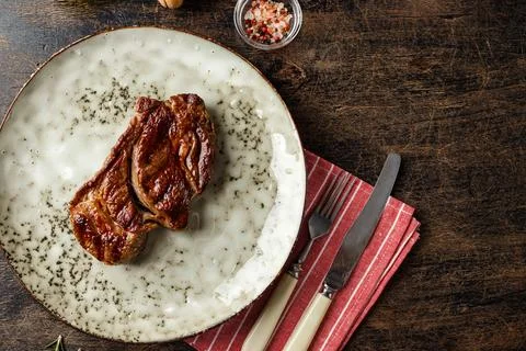 Two beef steak on dark gray background Stock Photos