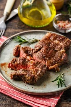 Two beef steak on dark gray background Stock Photos