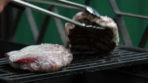 Two beef steaks grilled on charcoal Stock Footage 90020107