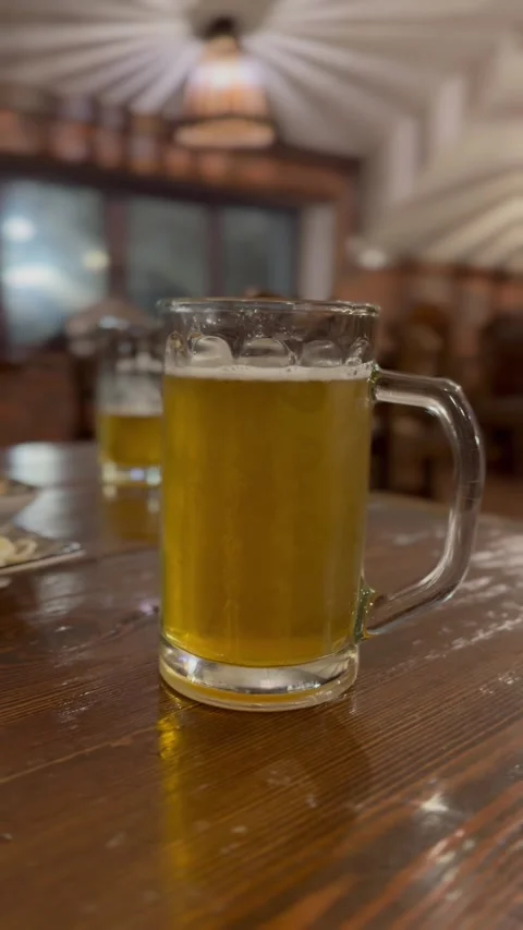 Two Beer Glasses at a Pub Stock Footage 297730859