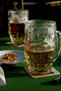 Two beers and table snacks Stock Photos