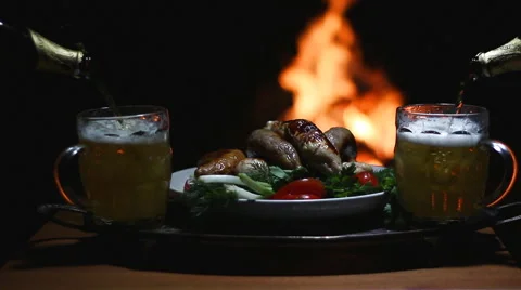 Two beers with flame on background Stock Footage 62856891